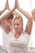 Group of people practising yoga