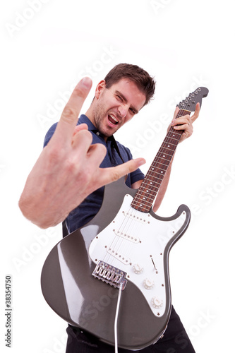 Photo: rockstar holding an electric guitar rockstar holding an electric guitar