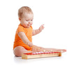 baby playing with musical toy