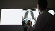 Doctor working in hospital during examination of x-rays