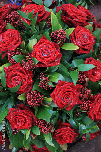 Photo: Red roses in a floral arrangement Red roses in a floral arrangement