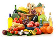 Composition with groceries and basket isolated on white. Composition with groceries and basket isolated on white.