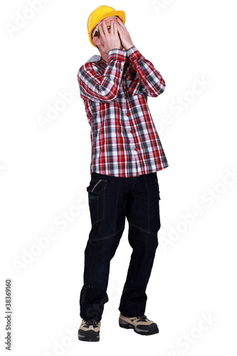 Photo: A despairing workman A despairing workman