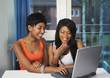 Photo: Girls socializing or chatting on internet having fun Girls socializing or chatting on internet having fun