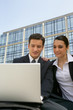 Business couple outside place of work