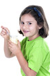 little girl eating yogurt