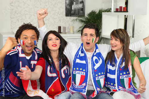 Photo: Italian football supporters watching match from home Italian football supporters watching match from home