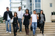 Young men and young women coming down stairs