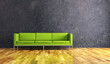 Wohndesign - grünes Sofa vor Betonwand