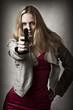 Portrait of sexy blond woman with hand gun