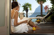 Photo: woman on the terrace read a book woman on the terrace read a book