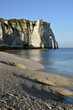 Pebble beach and cliff of Etretat in France