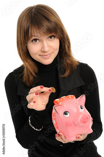 Photo: girl with a piggybank girl with a piggybank