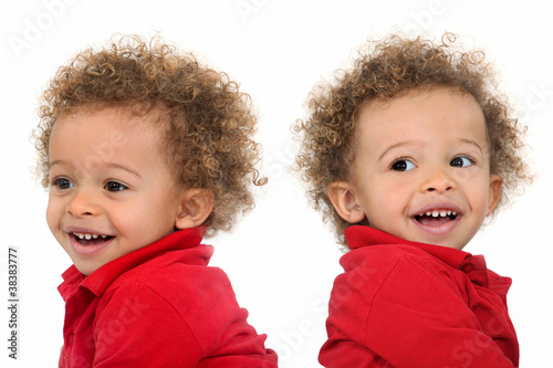 Photo: Adorable-looking twins with curly hair Adorable-looking twins with curly hair