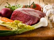 meat with vegetables ingredients over cutting board