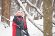 Boy with stick looking up