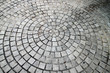 Closeup view on a cobblestone road - circle pattern - background