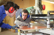craftsman and his apprentice working together