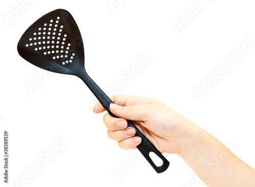 Photo: Female hand with skimmer isolated on white background Female hand with skimmer isolated on white background