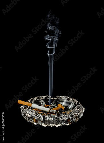 Photo: Smoking cigarette in ashtray Smoking cigarette in ashtray