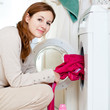 Housework: young woman doing laundry