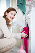 Housework: young woman doing laundry