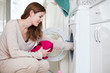 Housework: young woman doing laundry