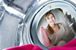 Housework: young woman doing laundry