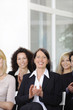 Business team applauding after a conference