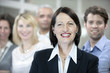 Portrait of a mature businesswoman and business team