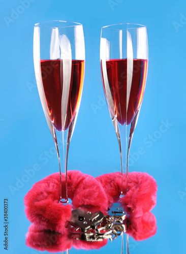 Photo: Two wine glasses and love cuffs Two wine glasses and love cuffs