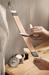 Photo: A man carefully stropping his straight razor A man carefully stropping his straight razor