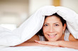 Woman under the sheets