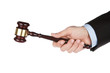 Foto: Male hand holding wooden gavel isolated on white background Male hand holding wooden gavel isolated on white background