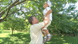 elderly man playing with young boy
