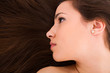 beautiful young female face with long beauty hair as background