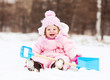 baby with a toy spade