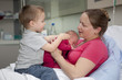 A mother with her 2 children at maternity A mother with her 2 children at maternity