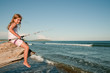 Fishing -  girl fishing at the beach