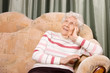 Photo: Portrait of the old woman on a sofa Portrait of the old woman on a sofa