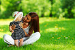 Photo: Mother and daughter on the green grass Mother and daughter on the green grass