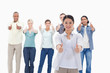 Photo: Close-up of people smiling with their thumbs-up Close-up of people smiling with their thumbs-up