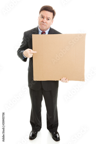 Photo: Sad Businessman with Cardboard Sign Sad Businessman with Cardboard Sign