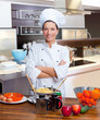 Chef woman portrait in the kitchen