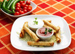 Tortilla potatoes with chicken meat, vegetables and souce