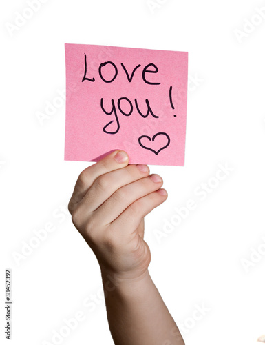 Photo: boy hand holding notepaper on white background boy hand holding notepaper on white background