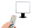 Hand with remote control and tv