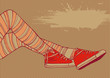 background with female legs in striped stockings and sneakers