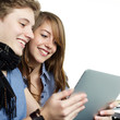 Foto: Young couple surfing on the internet with touchpad Young couple surfing on the internet with touchpad
