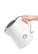 Womens hand and white electric kettle isolated on white